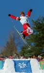 Deidre Dionne of Red Deer flies over the huge crowd at Deer Valley, Utah, to qualify fifth for Monday's aerials final at the Winter Olympics, Sat., Feb. 16, 2002.  (CP PHOTO/COA/Mike Ridewood)