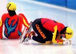 Canada's Annie Perreault comforts team-mate Isabelle Charest after a disappointing fall during the race at the 1998 Nagano Winter Olympics. (CP PHOTO/COA)