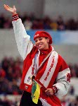 Canada's Catriona Le May Doan waves to the crowd from the winners block after winning a gold meal in the women's long track speed skating event at the 1998 Nagano Winter Olympics. (CP PHOTO/COA)