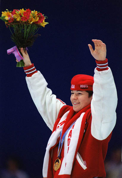 Canada's Annie Perreault celebrates after winning the gold medal in the women's speed skating event at the 1998 Nagano Winter Olympics. (CP PHOTO/COA)