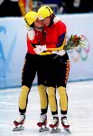 Canada's Annie Perreault stands on the winners podium after winning a gold medal in the women's short track speed skating event at the 1998 Nagano Winter Olympics. (CP PHOTO/COA)