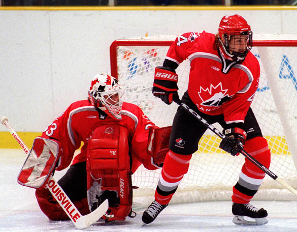 Canada's Becky Kellar (R) and Manon Rheaume playing women's hockey at the 1998 Nagano Winter Olympics. (CP PHOTO/COA)