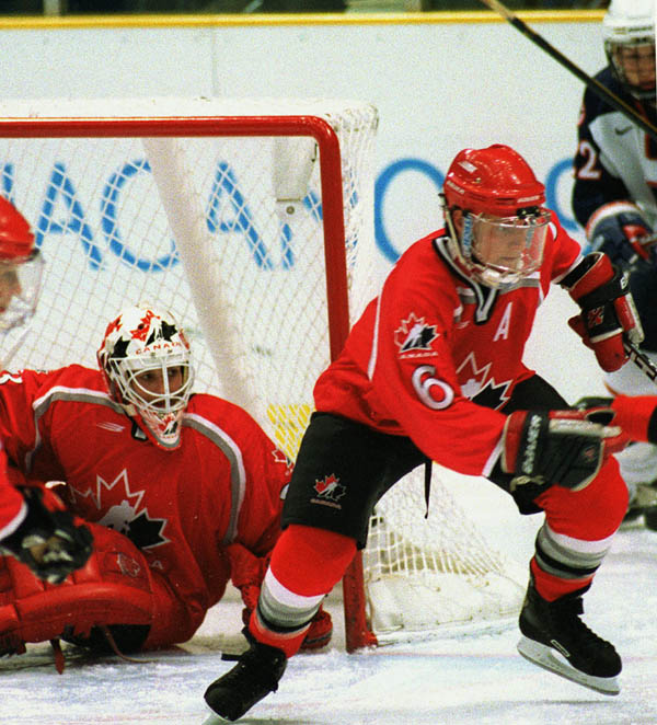 Canada's Laura Schuler, Manon Rheaume and Therese Brisson in action against their opponents at the 1998 Nagano Winter Olympics. (CP PHOTO/COA)