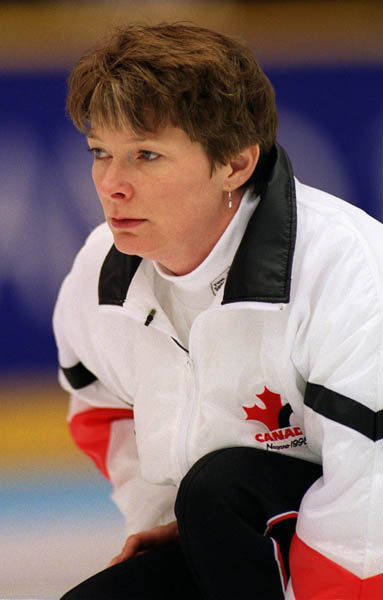 Canada's Jan Betker watches her team mates sweep a path for her rock during a curling match at the 1998 Nagano Winter Olympics. (CP PHOTO/COA)