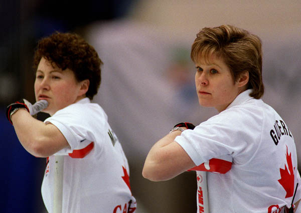 Canada's Marcia Gudereit an Joan McCusker take a break from play during a curling match at the 1998 Nagano Winter Olympics. (CP PHOTO/COA)