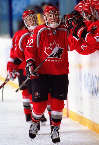 Canada's Hayley Wickenheiser greets her team-mates before a game of hockey at the 1998 Nagano Winter Olympics. (CP PHOTO/COA)