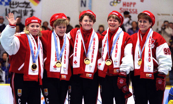 Canada's Women's curling team left to right Atina Ford, Marcia Gudereit, Joan McCusker, Jan Betker and Sandra Schmirler, after winning a gold medal in the event at the 1998 Nagano Winter Olympics. (CP PHOTO/COA)