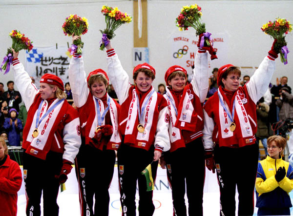 Canada's Women's curling team Atina Ford, Marcia Gudereit, Joan McCusker, Jan Betker and Sandra Schmirler after winning a gold medal at the 1998 Nagano Winter Olympics. (CP PHOTO/COA)