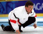 Canada's George Karrys watches thoughtfully as the opposing team takes their turn at the 1998 Nagano Winter Olympics. (CP PHOTO/COA)