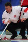 Canada's Mike Harris ponders his next move during a curling match at the 1998 Nagano Winter Olympics. (CP PHOTO/COA)