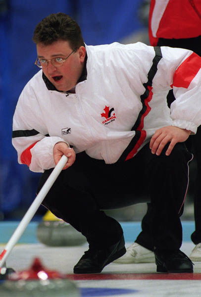 Canada's Mike Harris shouts instructions to his team-mates during a match of curling at the 1998 Nagano Winter Olympics. (CP PHOTO/COA)