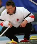 Canada's Mike Harris ponders his next move during a curling match at the 1998 Nagano Winter Olympics. (CP PHOTO/COA)