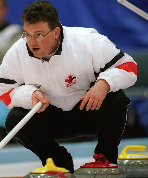Canada's Mike Harris giving instructions to his team mates during a curling match at the 1998 Nagano Winter Olympics. (CP PHOTO/COA)