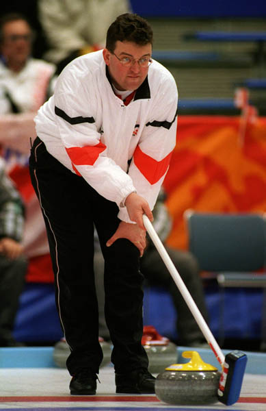 Canada's Mike Harris curling at the 1998 Nagano Winter Olympics. (CP PHOTO/COA)