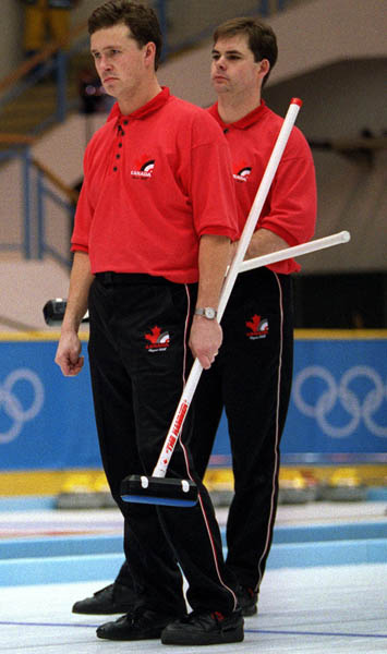 Canada's Collin Mitchell and Richard Hart curling at the 1998 Nagano Winter Olympics. (CP PHOTO/COA)