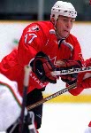 Canada's Rod Brind'Amour (17) is checked in the boards during hockey action against the United States at the 1998 Winter Olympics in Nagano. (CP Photo/COA/ F. Scott Grant )