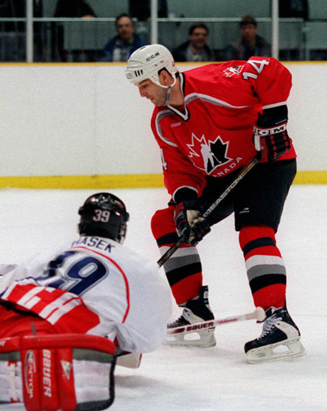 Canada's Brendan Shanahan in action against his opponent Domenik Hasek of the Czech Republic at the 1998 Nagano Winter Olympics. (CP PHOTO/COA)