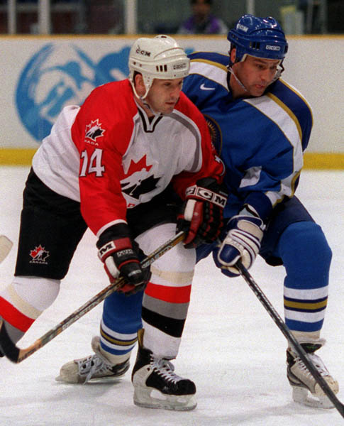 Canada's Brendan Shanahan in action against his opponent at the 1998 Nagano Winter Olympics. (CP PHOTO/COA)