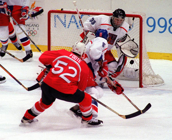 Canada's Adam Foote scores a goal during game play at the 1998 Nagano Winter Olympics. (CP PHOTO/COA)