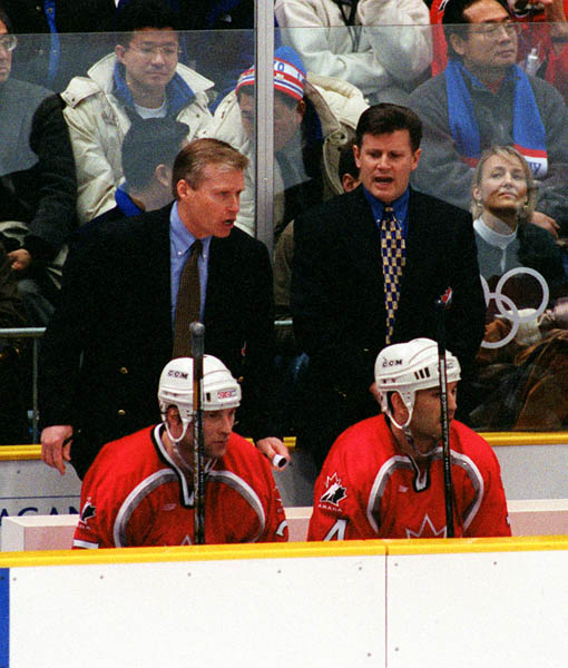 Canada's Wayne Cashman (L) and Marc Crawford, coaches for the Canadian Men's Hockey Team, at the 1998 Nagano Winter Olympics. (CP PHOTO/COA)