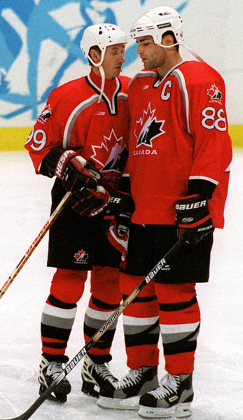 Canada's Wayne Gretzky (L) and Eric Lindros playing hockey at the 1998 Nagano Winter Olympics. (CP PHOTO/COA)