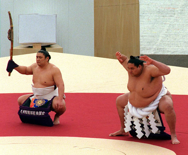Sumo wrestlers perform during the opening ceremony at the 1998 Nagano Winter Olympics. (CP PHOTO/COA)
