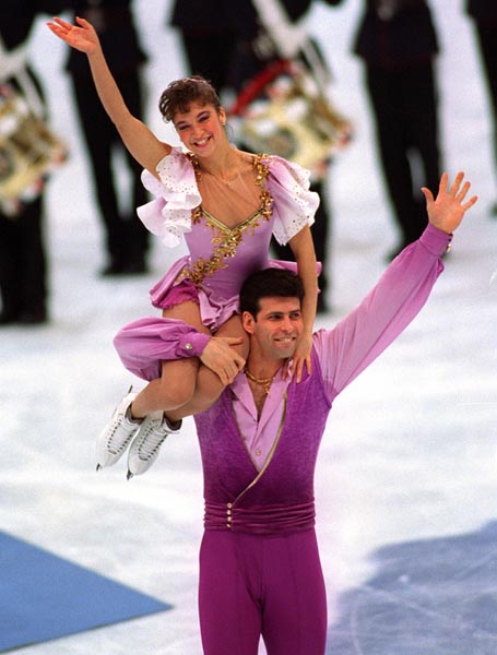 Canada's Isabelle Brasseur and Lloyd Eisler wave to the crowd after competition at the 1994 Lillehammer Winter Olympics. (CP PHOTO/ COA)