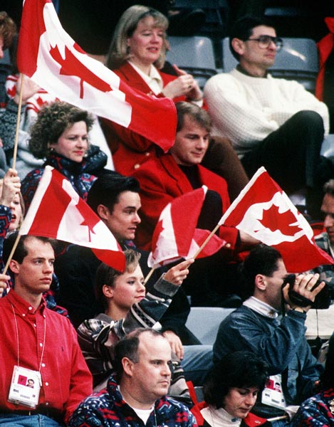 Canada's Kurt Browning and Sebastien Britten sit in the crowd with fans during the figure skating event at the 1994 Lillehammer Winter Olympics. (CP PHOTO/ COA)