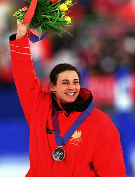 Canada's Susan Auch waves to the crowd of supporters after winning the silver medal in the women's long track speed skating event at the 1994 Lillehammer Winter Olympics. (CP PHOTO/ COA)