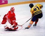 Canada's Corey Hirsch and Todd Hlushko in action during the gold medal game which Sweden won 3-2 in a shoot out at the 1994 Lillehammer Winter Olympics. (CP PHOTO/ COA)