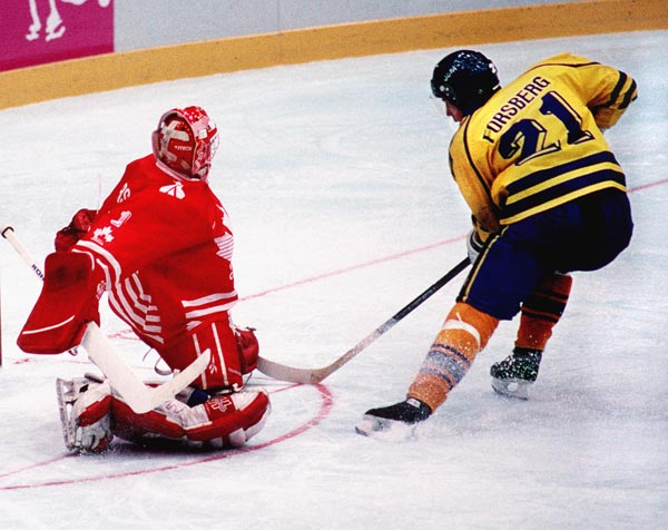 Canada's Corey Hirsch in action against Sweden's Peter Forsberg during the gold medal game which Sweden won 3-2 in a shoot out at the 1994 Lillehammer Winter Olympics. (CP PHOTO/ COA)