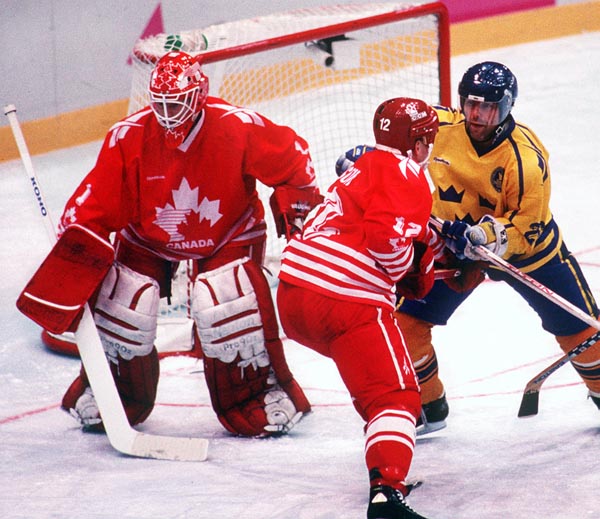 Canada's Corey Hirsch and Derek Mayer in action during the gold medal game which Sweden won 3-2 in a shoot out at the 1994 Lillehammer Winter Olympics. (CP PHOTO/ COA)