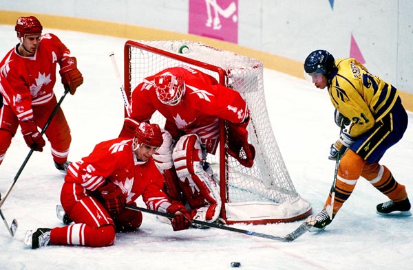 Canada's Corey Hirsch, Peter Nedved and Brian Savage in action during the gold medal game which Sweden won 3-2 in a shoot out at the 1994 Lillehammer Winter Olympics. (CP PHOTO/ COA)
