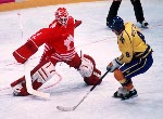 Canada's Corey Hirsch and Todd Hlushko in action during the gold medal game which Sweden won 3-2 in a shoot out at the 1994 Lillehammer Winter Olympics. (CP PHOTO/ COA)