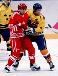(From left to right) Canada's Chris Kontos, Paul Kariya and Brad Schlegel celebrate during hockey action at the 1994 Winter Olympics in Lillehammer. (CP Photo/COA/Claus Andersen)