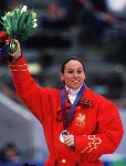 Canada's Nathalie Lambert celebrates her silver medal win in the women's short track speed skating event at the 1994 Lillehammer Winter Olympics. (CP Photo/COA/F. Scott Grant)