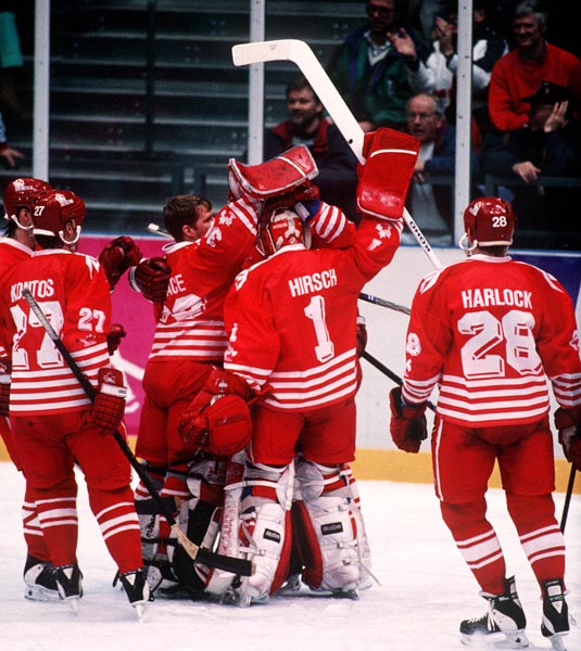 Team Canada rejoices after winning against Sweden at the 1994 Lillehammer Winter Olympics. (CP PHOTO/ COA)