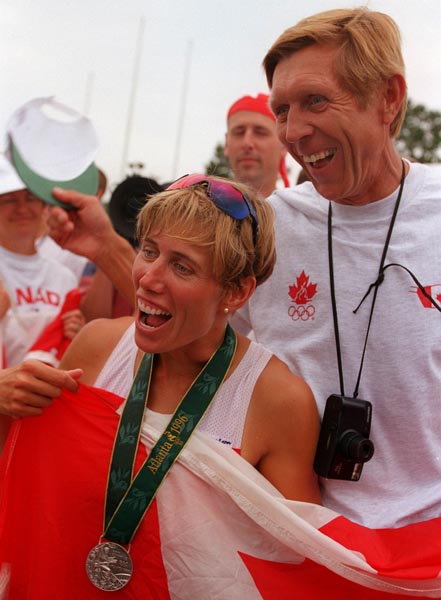 Canada's Silken Laumann celebrates the silver medal she won for women's 1x sculls event at the 1996 Atlanta Summer Olympic Games. (CP PHOTO/COA/Mike Ridewood)