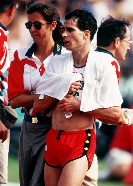 Canada's Peter Fonseca leaves the track after finishing the marathon event at the 1996 Atlanta Summer Olympic Games.  (CP PHOTO/COA/Claus Andersen)