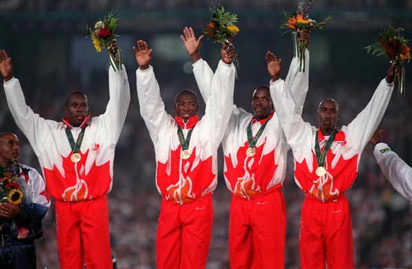Canada's men's 4x100m relay gold medal winners left to right Bruny Surin, Glenroy Gilbert, Donovan Bailey and Robert Esmie at the 1996 Atlanta Summer Olympic Games.(CP PHOTO/COA/Claus Andersen)