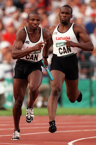 Canada's Donovan Bailey (foreground) and Bruny Surin competing in the men's 4x100m relay at the 1996 Atlanta Summer Olympic Games.(CP PHOTO/COA/Claus Andersen)