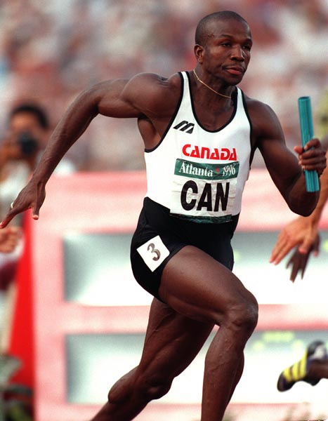 Canada's Donovan Bailey competing in the men's 4x100m relay at the 1996 Atlanta Summer Olympic Games.(CP PHOTO/COA/Claus Andersen)