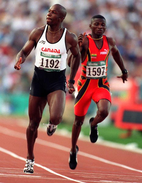 Canada's Donovan Bailey (left) competing in the men's 100m event at the 1996 Atlanta Summer Olympic Games. (CP PHOTO/COA/Claus Andersen)