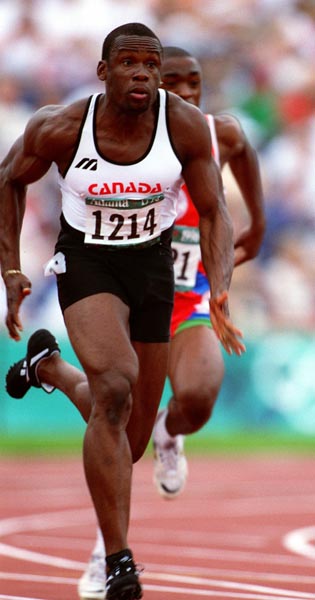 Canada's Bruny Surin competing in the 100m relay at the 1996 Atlanta Summer Olympic Games.(CP PHOTO/COA/Claus Andersen)