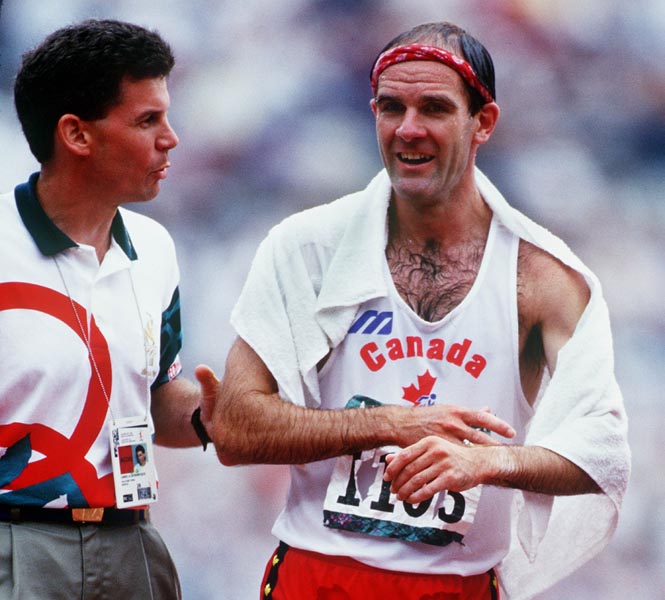 Canada's Tim Berrett (right) after completing the 50km walk at the 1996 Atlanta Summer Olympic Games. (CP PHOTO/COA/Claus Andersen)