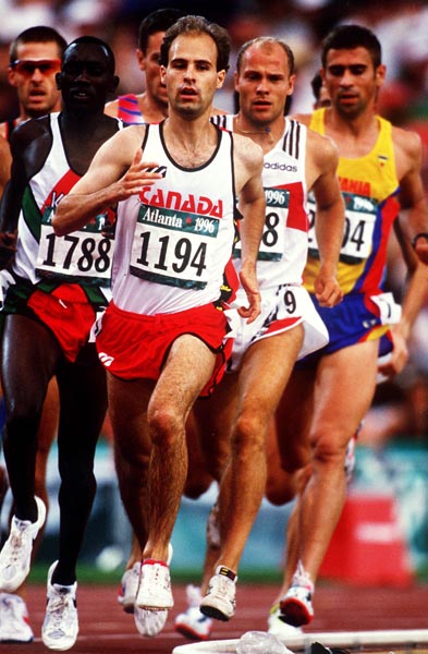 Canada's Joel Bourgeois (front) competing in the 3000m steeplechase event at the 1996 Atlanta Summer Olympic Games. (CP PHOTO/COA/Claus Andersen)