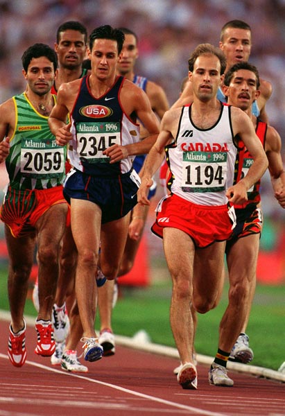 Canada's Joel Bourgeois (front) competing in the 3000m steeplechase event at the 1996 Atlanta Summer Olympic Games. (CP PHOTO/COA/Claus Andersen)