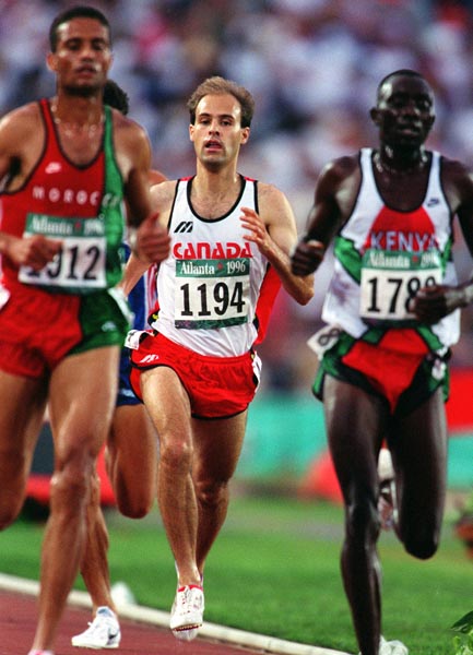 Canada's Joel Bourgeois (centre) competing in the 3000m steeplechase event at the 1996 Atlanta Summer Olympic Games. (CP PHOTO/COA/Claus Andersen)