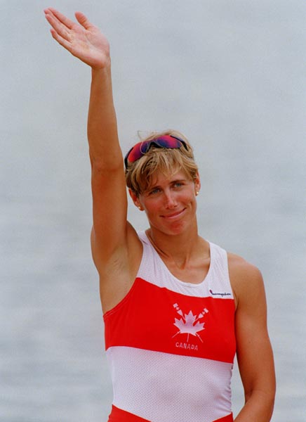 Canada's Silken Laumann waves to the crowd from the winners podium at the 1996 Atlanta Summer Olympic Games. (CP PHOTO/COA/Mike Ridewood)