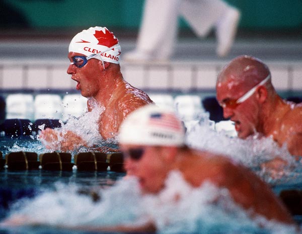 Canada's Jon Cleveland (left) competing in the men's breast stroke event at the 1996 Atlanta Summer Olympic Games. (CP PHOTO/COA/Claus Andersen)